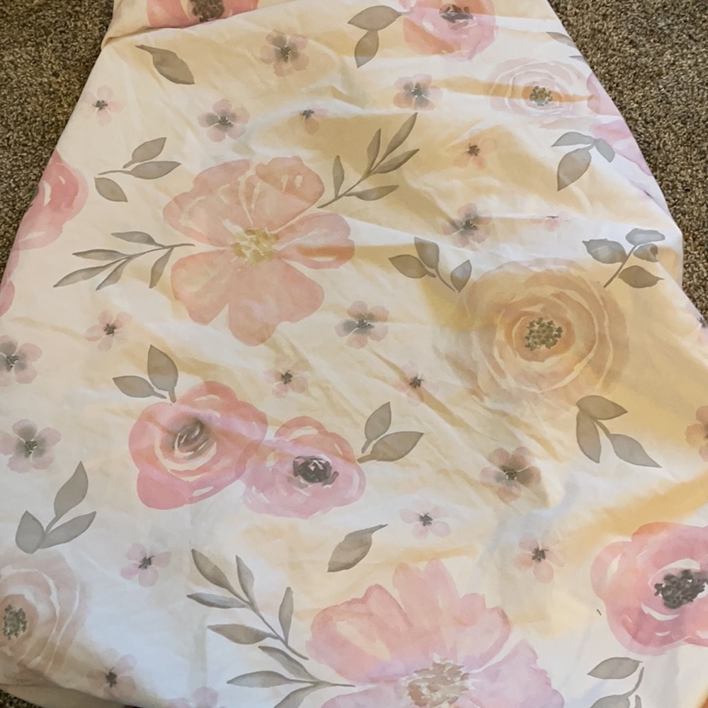 Pink crib skirt and floral sheet